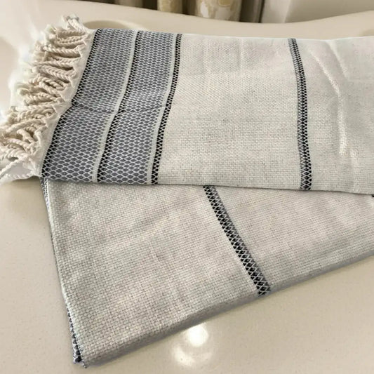 White and grey striped linen Turkish bath towel with tassels from Osprey