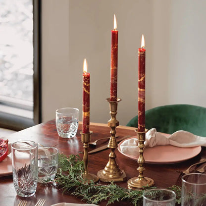 12’’ Decorative Taper Candles in red and gold on a table with candleholders and place setting