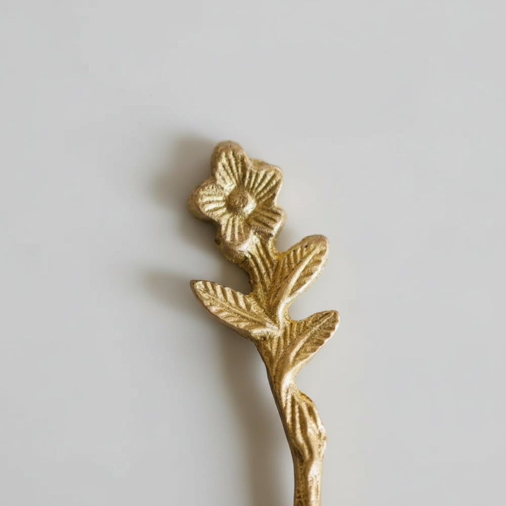 Gold floral brooch with intricate leaf details on Adavi Brass Mini Serving Utensils