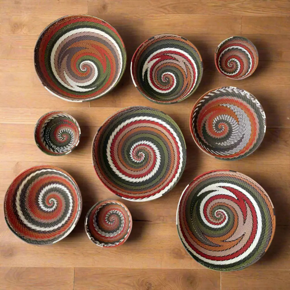 African Zulu wire bowl collection with handcrafted woven spiral patterns from recycled telephone wire