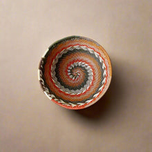 Colorful coiled Zulu wire bowl woven from recycled telephone wire African Zulu style