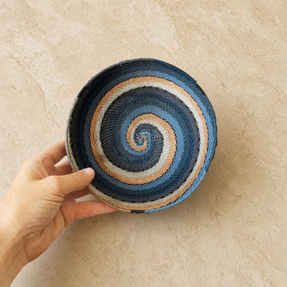Handwoven african zulu spiral bowl in navy beige and light blue made from recycled telephone wire city lights design