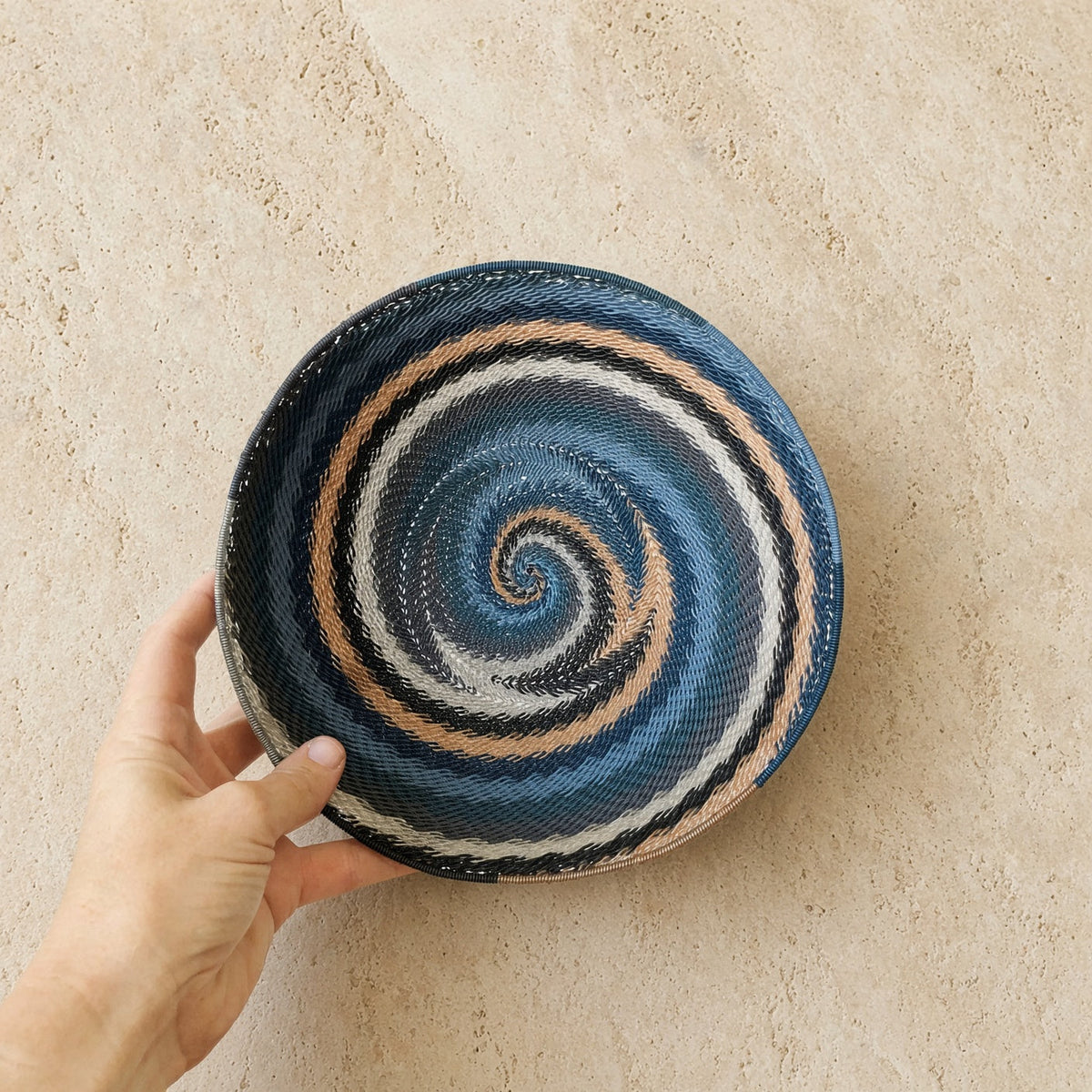 Handwoven african zulu bowl in city lights design with blue black white beige spiral made from recycled telephone wire
