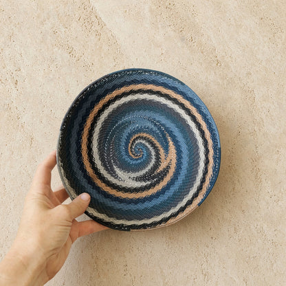 Handwoven african zulu bowl in city lights design with blue black white beige spiral made from recycled telephone wire
