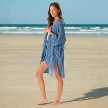 Young woman in blue striped Aloha Tribal Cover Up, perfect handmade beach cover