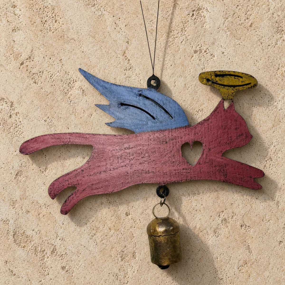 Painted angel cat bell chime ornament with blue wings yellow halo heart cutout and rust patina bell hanging from string