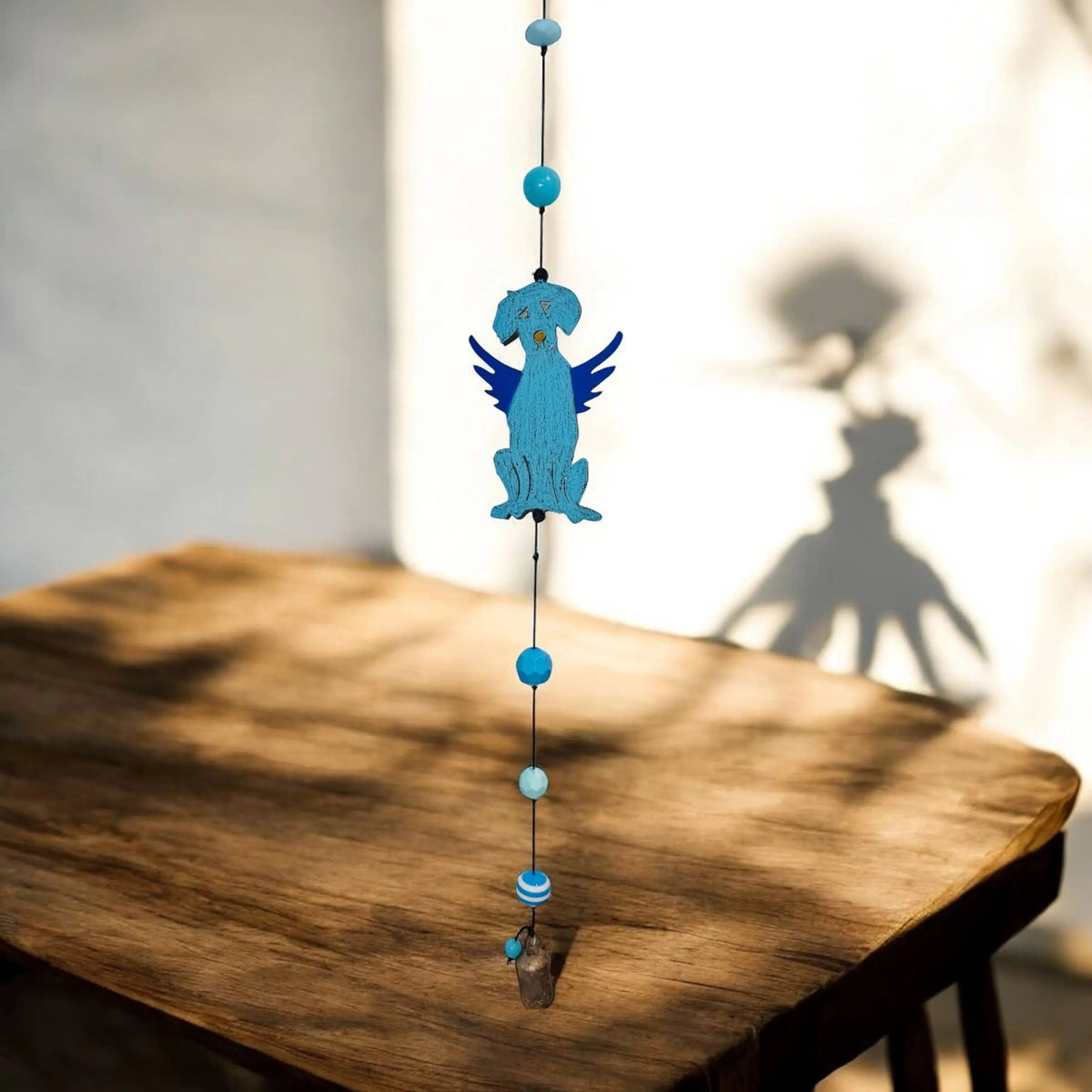 Handmade turquoise metal dog wind chime with blue wings and beads