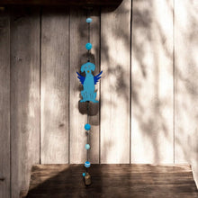 Handmade metal dog wind chime with blue angelic design and turquoise beads