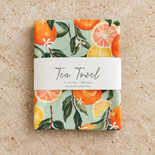 Artisan tea towel with hand-painted oranges and a cheerful tea towel design on a mint green background