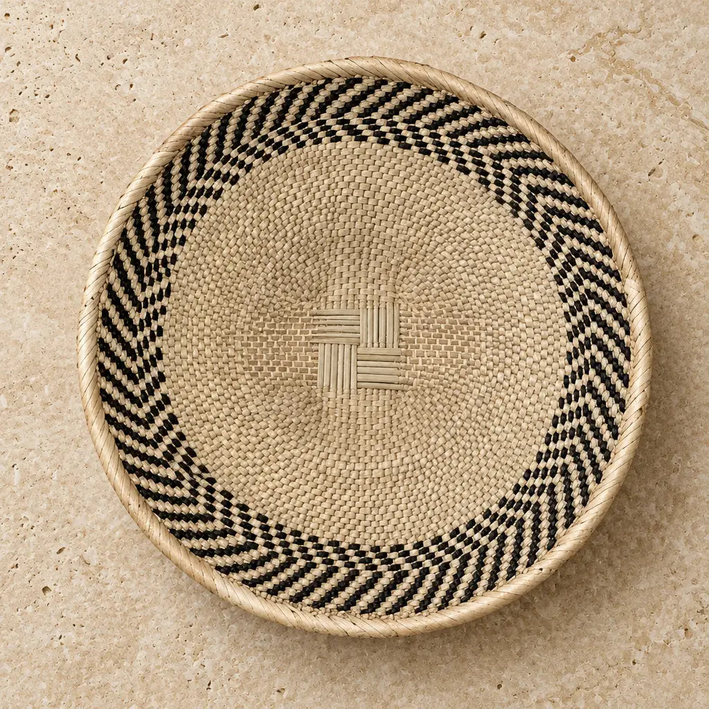 Authentic binga basket with natural beige base black and white chevron border and central woven cross design 12.5 inches
