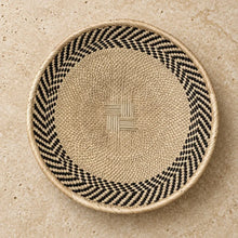Authentic binga basket with natural beige base black and white chevron border and central woven cross design 12.5 inches