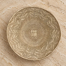 Authentic binga basket wall decor in beige handwoven with intricate geometric patterns and central woven square
