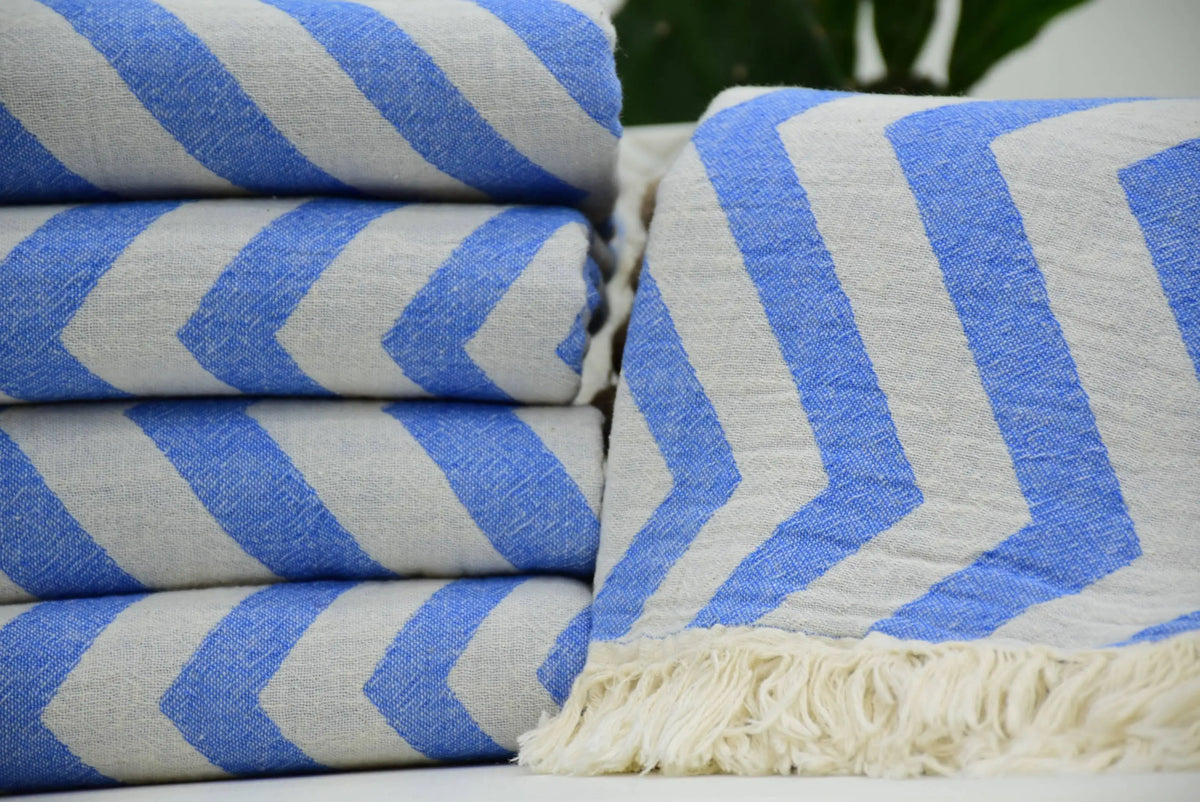 Turkish towel with blue and white zigzag design pale sax blue cotton fabric and fringed edge perfect for beach use