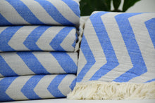 Turkish towel with blue and white zigzag design pale sax blue cotton fabric and fringed edge perfect for beach use