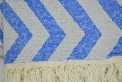 Turkish towel with zigzag design pale sax blue chevron pattern and cream-colored fringe for stylish use