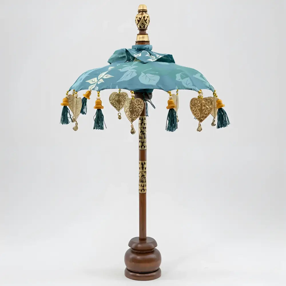 Balinese tabletop umbrella blue and green floral with teal fabric, gold embossed hearts, and tassels for grace temple ceremonies ornamental parasols