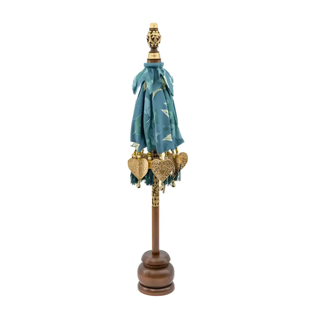 Balinese tabletop umbrella blue and green floral with teal fabric, gold heart ornaments, and tassels for grace temple ceremonies