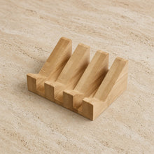 Light-colored bamboo soap lift with mountain-shaped design crafted and four angled slots for nature’s rugged beauty