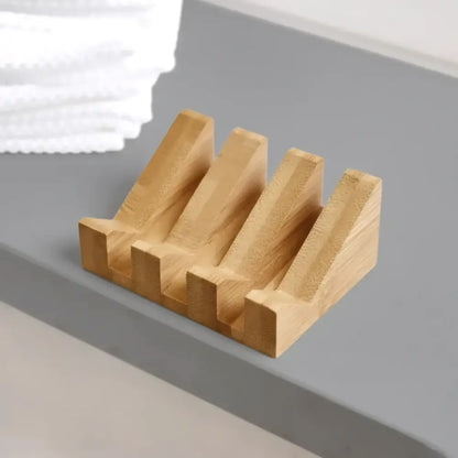 Light brown bamboo soap lift with four angled slots mountain-shaped design crafted to show nature’s rugged beauty