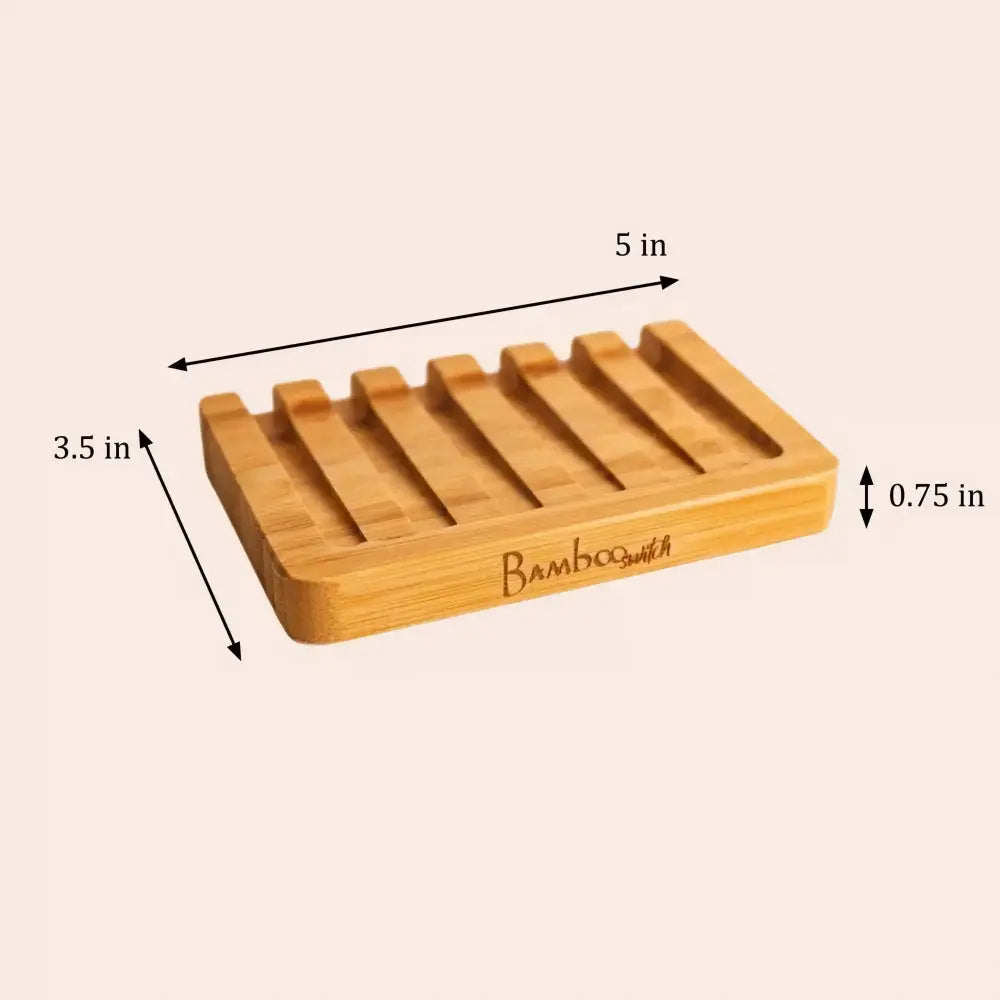 A light brown bamboo soap lift with five slotted compartments and bambooswitch brand name engraved on the side