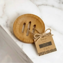 Bamboo soap lifter with natural wood finish and three vertical slots tied to tag by twine for bamboo shower steamer use