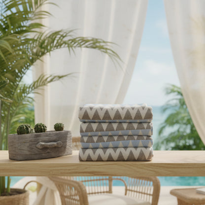 Stack of folded organic turkish towels with gray white and light blue zigzag pattern beach towel 36x78