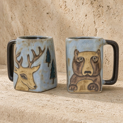 Hand-painted stoneware mug with deer and bear designs on light blue glaze and dark brown handles sturdy and unique