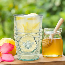 Clear recycled glass tumbler with a ribbed texture and lively bee embossing eco-friendly 11 oz design