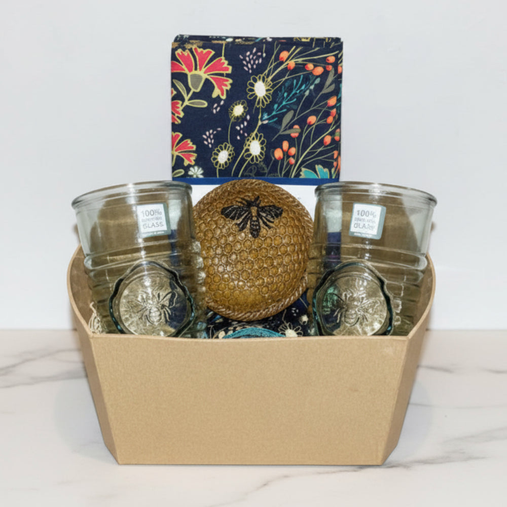 Golden honeycomb glass orb with bee atop Bee Nest Bundle tumblers