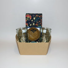Golden honeycomb glass orb with bee atop Bee Nest Bundle tumblers
