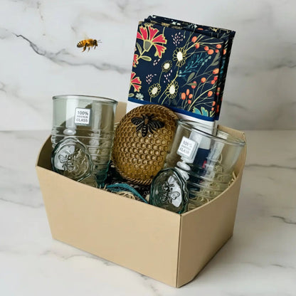 Golden honeycomb bee nest with black bee emblem in Bee Nest Curated Set