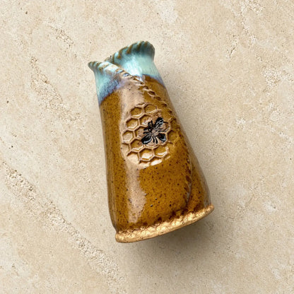 Bee vase handmade pottery 6 inches tall with mustard honeycomb pattern adorable bee designs glazed amber body and blue rim