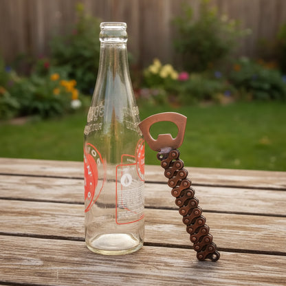 Rustic Bike Chain Bottle Opener with brown links and orange handle