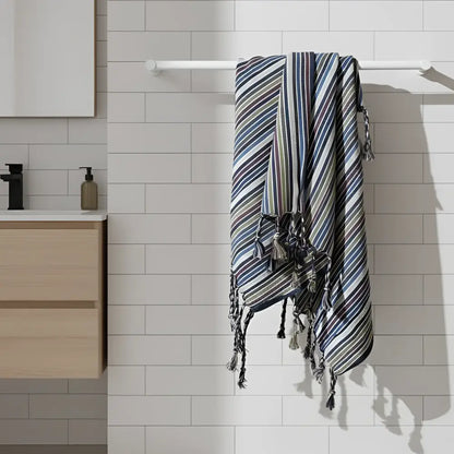Striped Turkish towel from Bird Bath Nest set on woven cotton