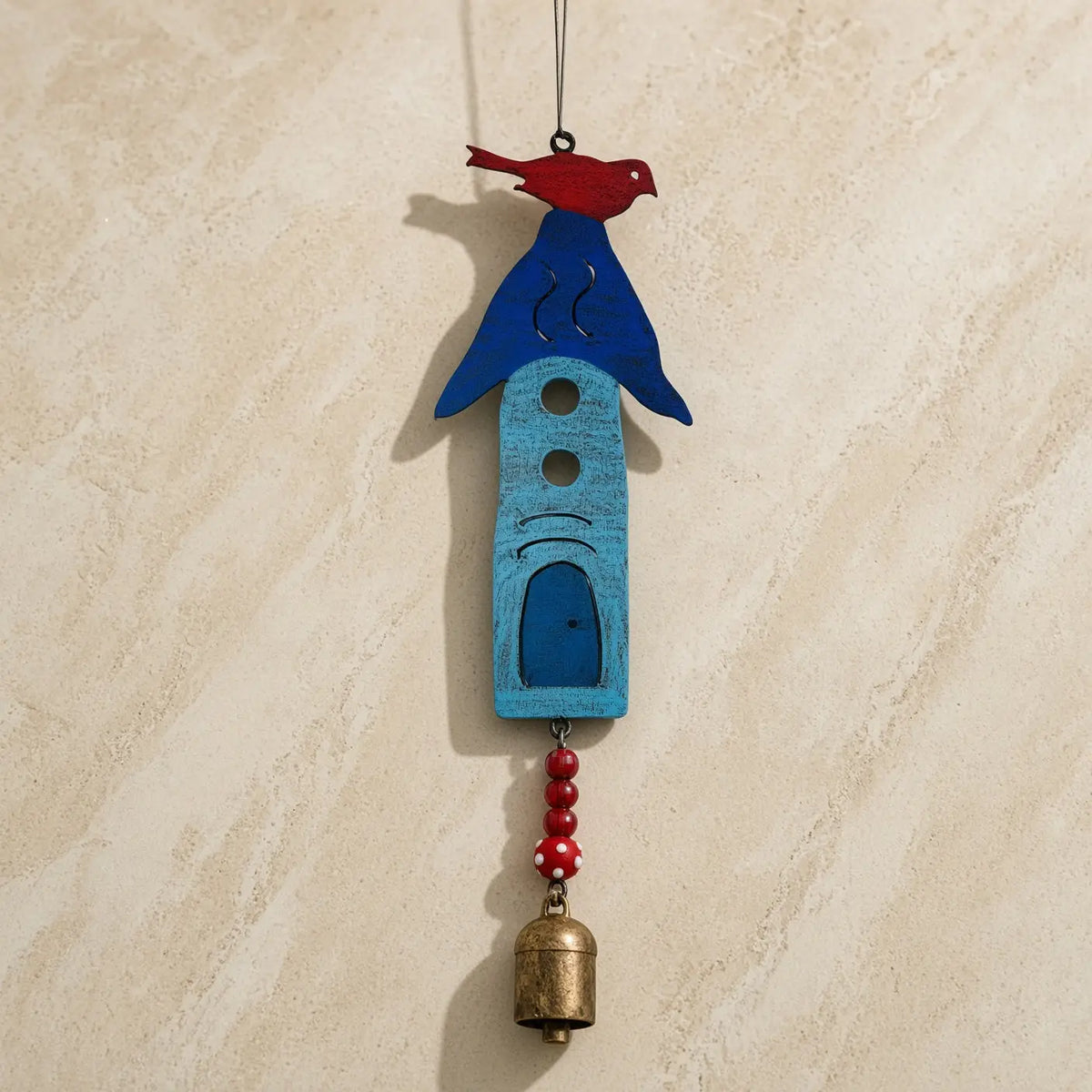 Blue wooden birdhouse ornament with red bird, dangling beads, and brass bell bird bell wind made from recycled metals