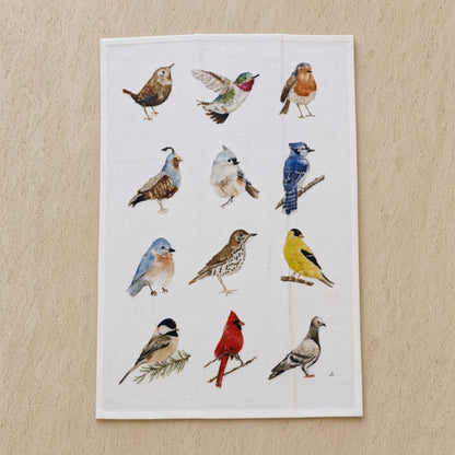 White cotton flour sack tea towel with watercolor illustrations of twelve different birds in naturalistic poses