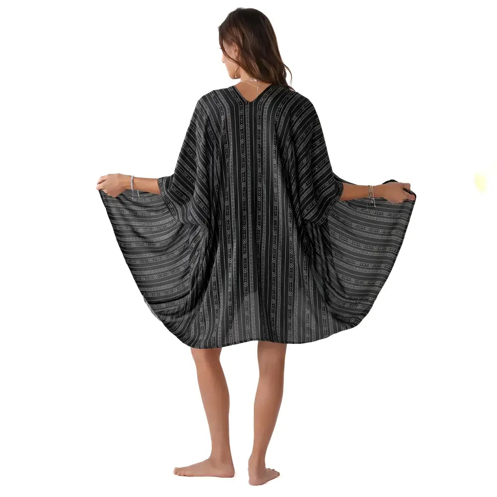 Black tribal print kimono cover-up with flowing wide sleeves and bold black and white stripes