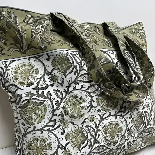 Large canvas tote bag with hand block printed design in muted greens and natural tones.