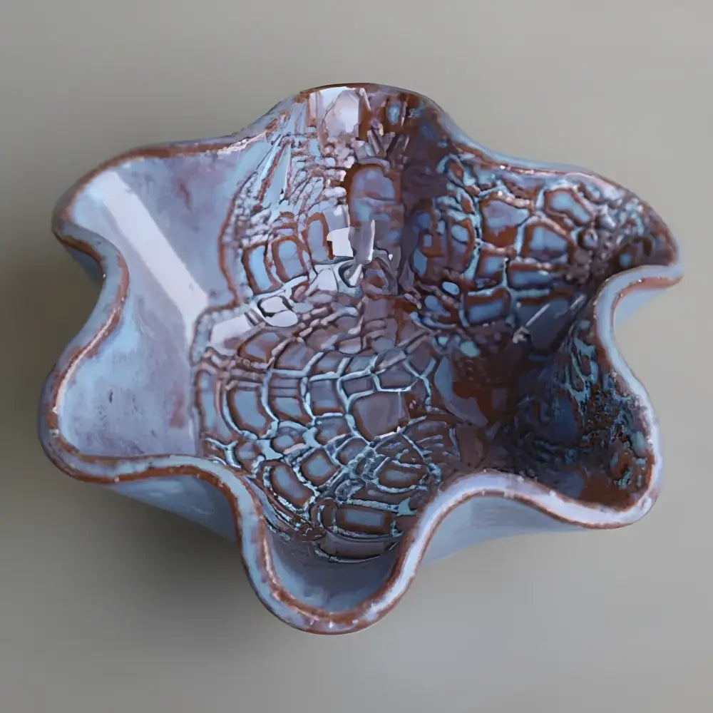 Blossom bowl with scalloped leaf edge and crackled blue brown glaze