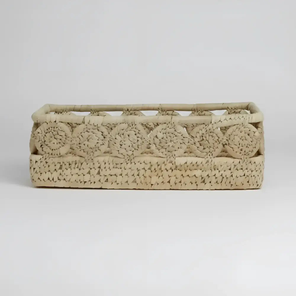 Blossom Nest palm medallion basket with intricate beige rattan weave