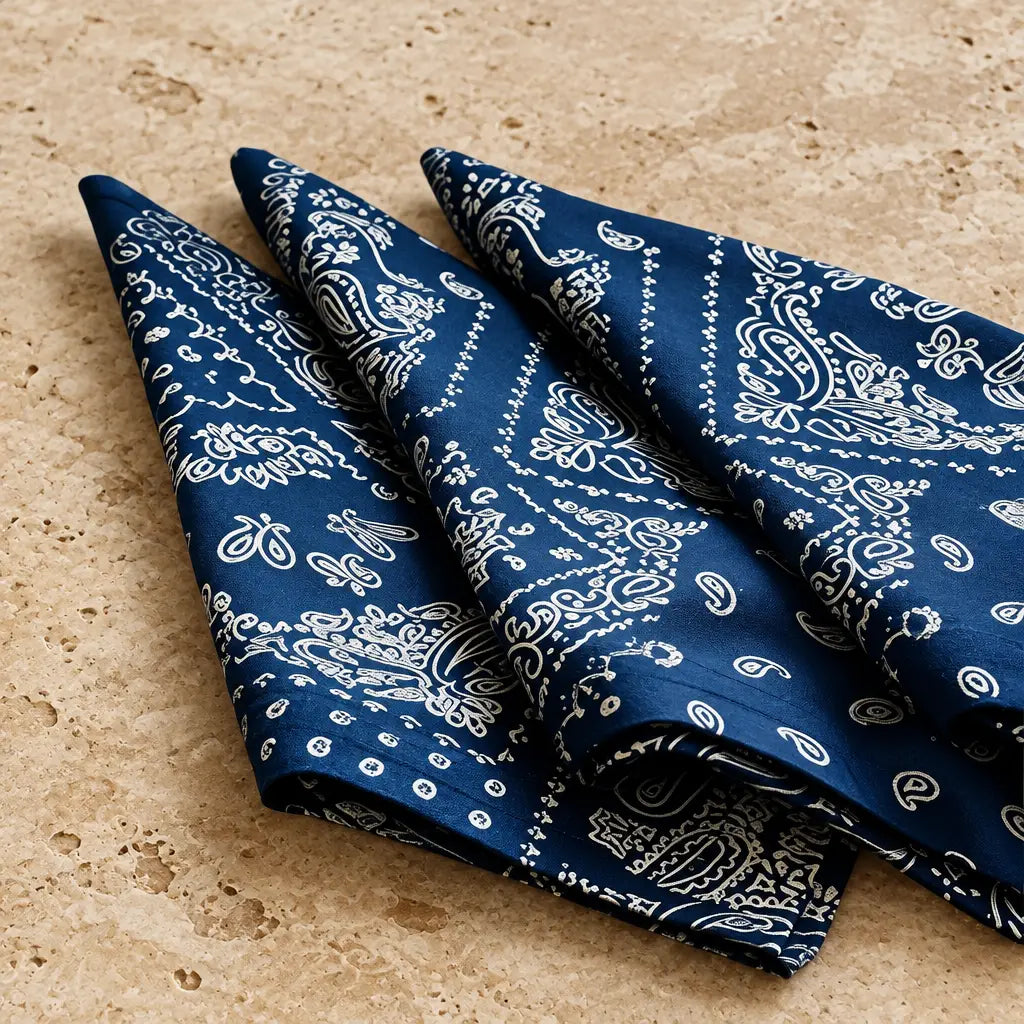 Deep blue bandana napkins set of 4 with intricate white paisley patterns perfect for casual dining and picnics
