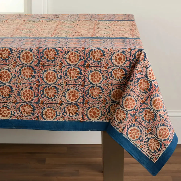Patterned fabric tablecloth with paisley print and blue border, perfect as a compass tablecloth