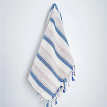 Blue and ivory striped hand woven Turkish hand towel with thin lines of red stripes.