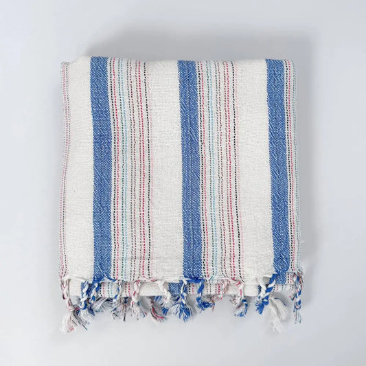 Blue and ivory striped hand woven Turkish hand towel with thin red stripes.