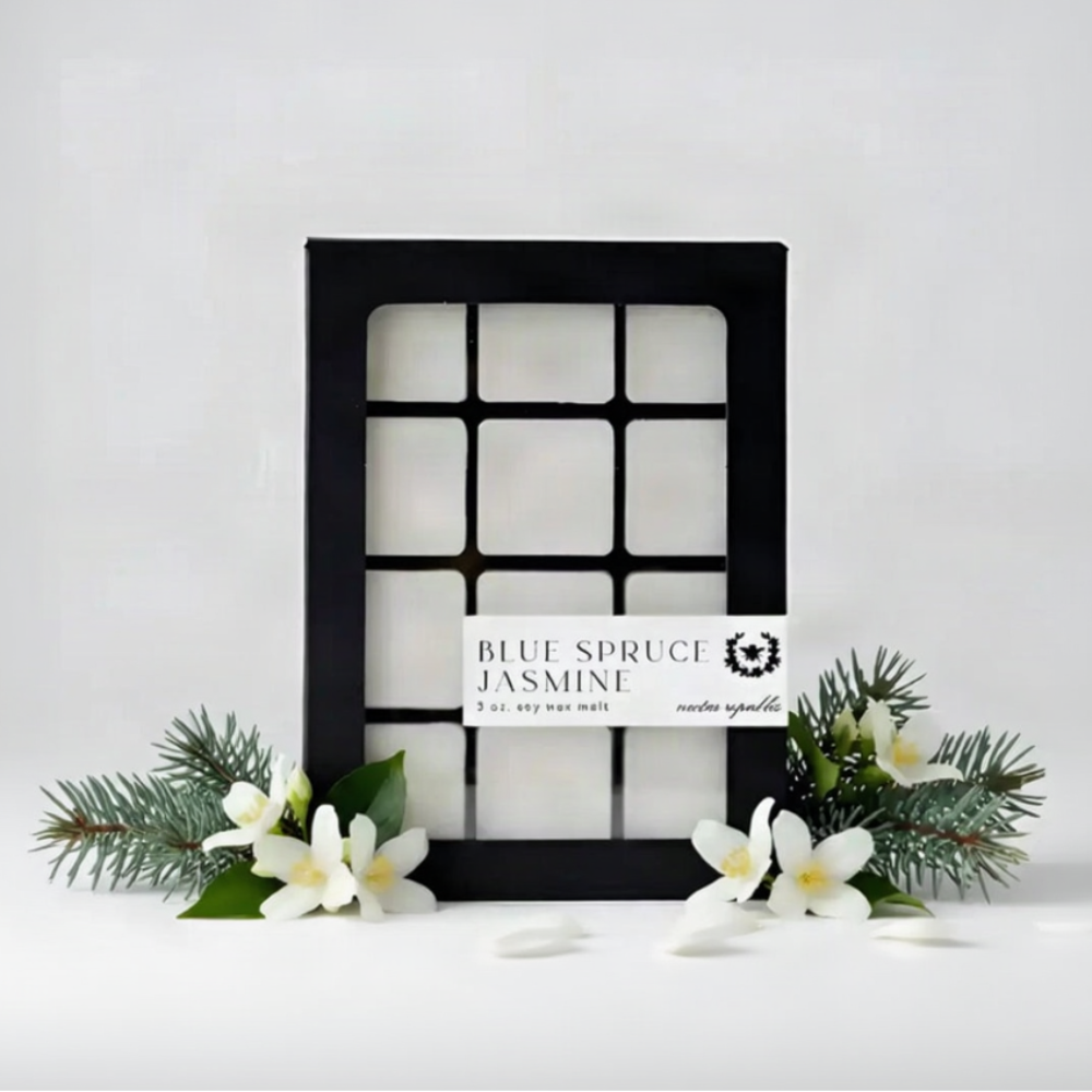 Black-framed box of twelve white soy wax melts labeled blue spruce jasmine by nectar republic with phthalate-free fragrance and essential oils