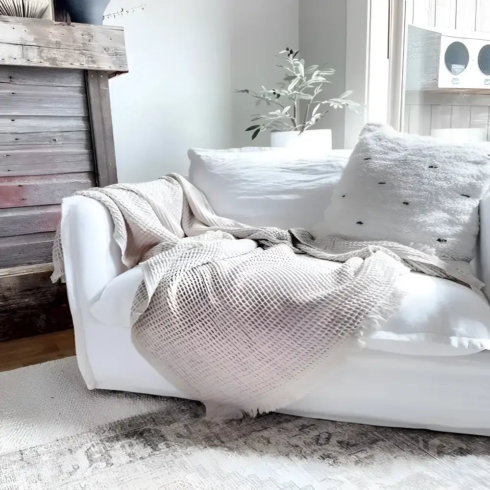 Handcrafted Bookworm Nest sofa with eco-friendly waffle throw and pillow