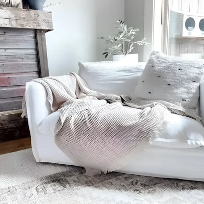 Handcrafted Bookworm Nest sofa with eco-friendly waffle throw and pillow