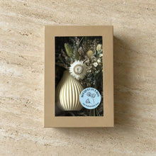 Cream-colored ribbed ceramic vase holding a dried floral bouquet from bouquet in a box small gift set by boyds custom fabrication