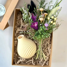 Cream-colored ribbed ceramic vase with vibrant dried floral bouquet perfect for boyds custom fabrication or 3d printed gifts