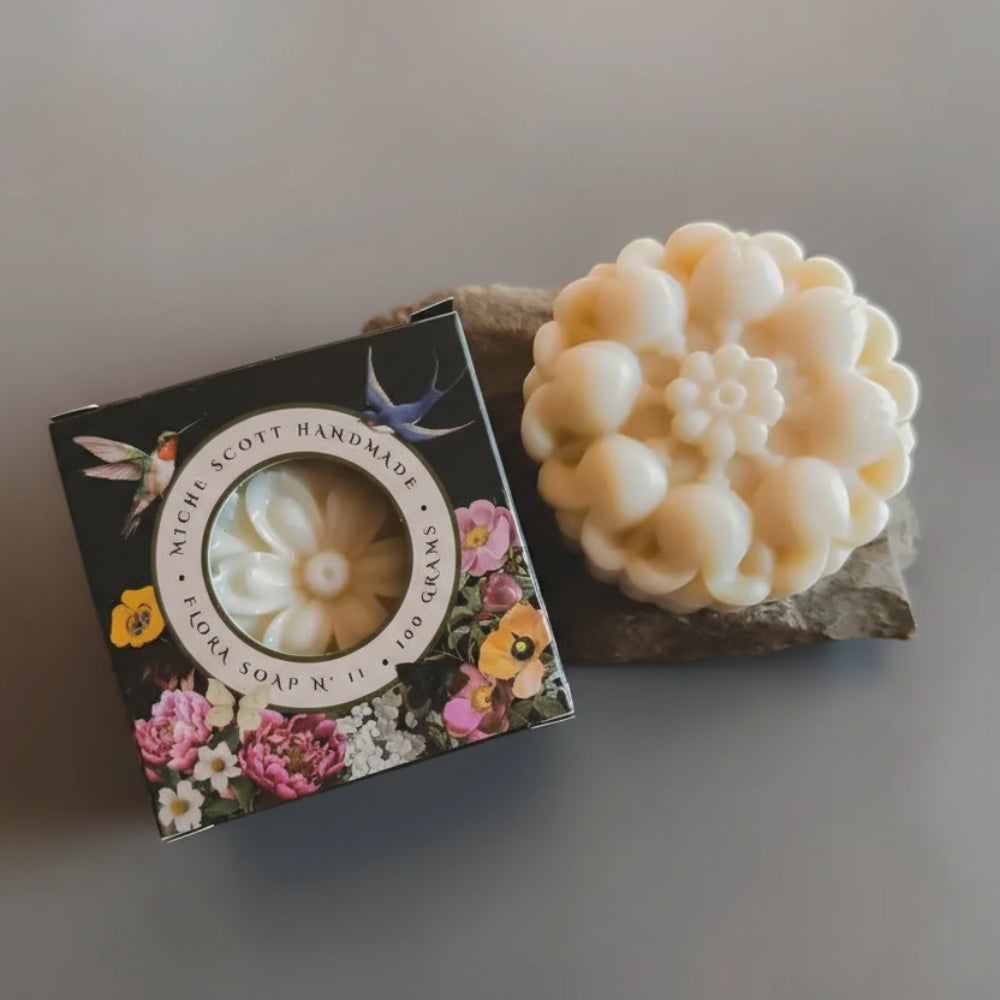 Cream-colored handmade soap with floral petal design in Boxed Flora N° 11